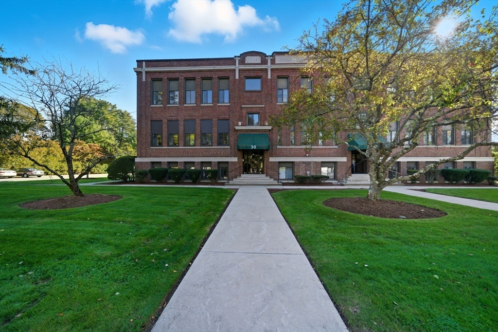 30 Conant Street, Unit 3B Beverly, MA 01915 - Photo 6 of 30 a front view of a house with a yard