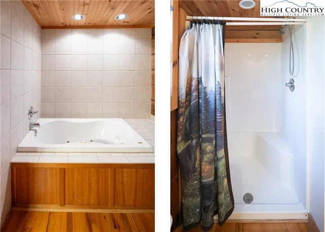 a bathroom with a tub and shower