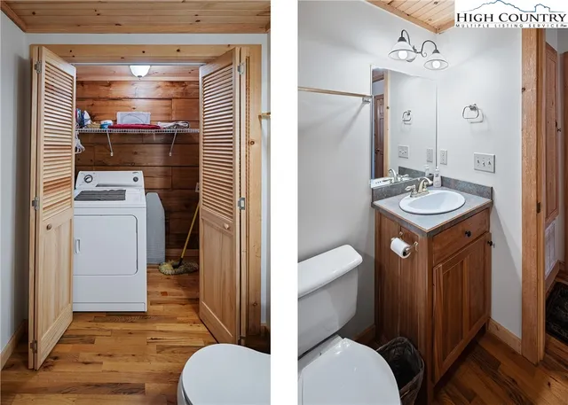 a bathroom with a granite countertop toilet sink and mirror