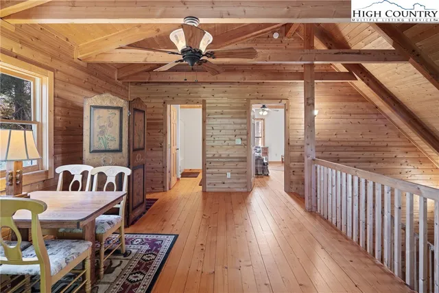 a view of a patio with table and chairs