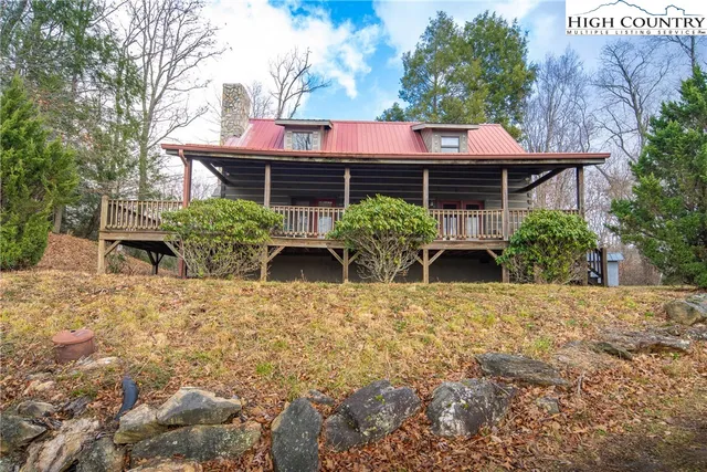 a front view of house with yard and seating area