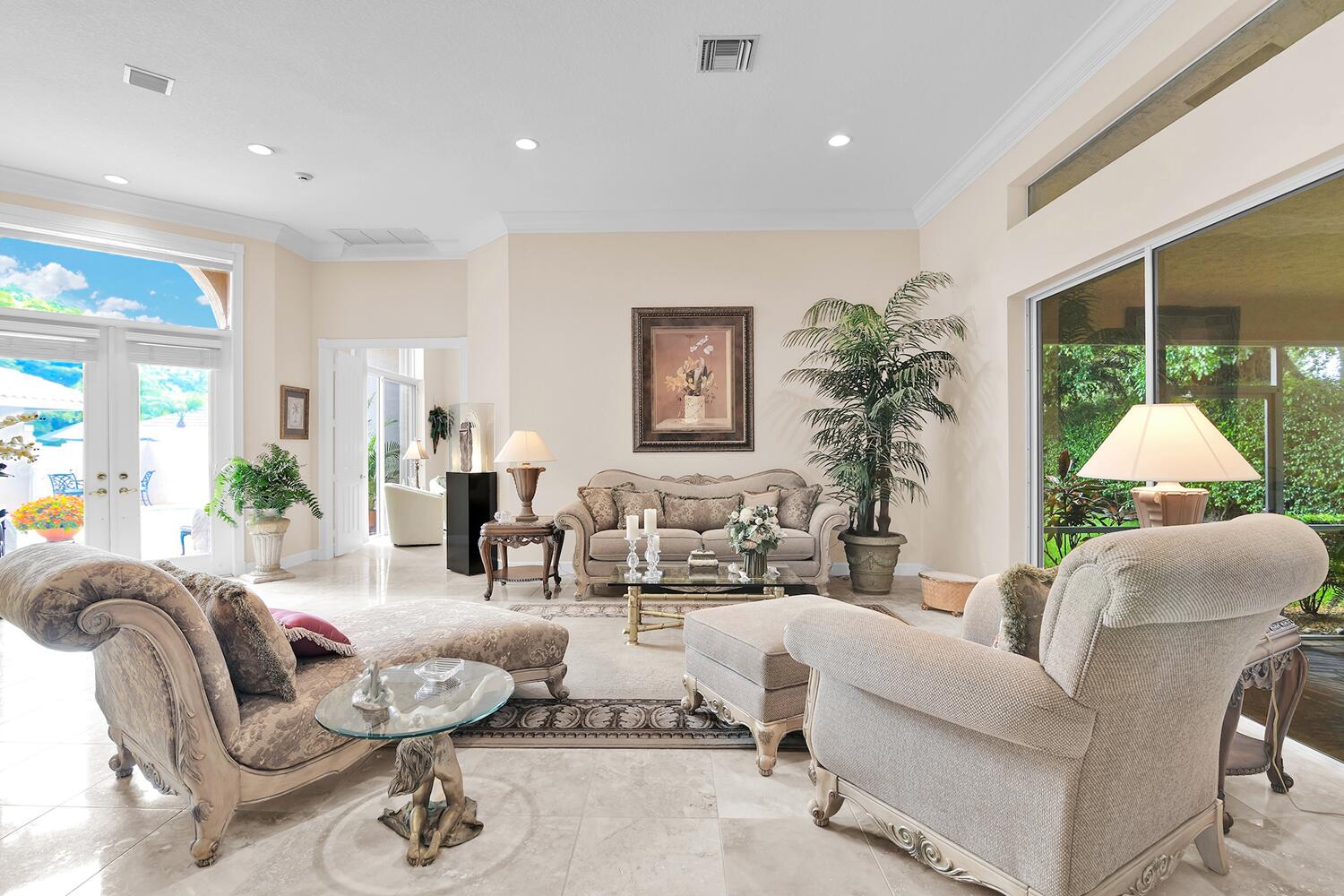 10721 St Andrews Road Boynton Beach, FL 33436 - Photo 12 of 27 a living room with furniture and a large window