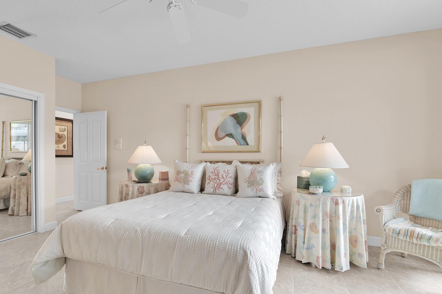 10721 St Andrews Road Boynton Beach, FL 33436 - Photo 16 of 27 a bedroom with a bed and a lamp