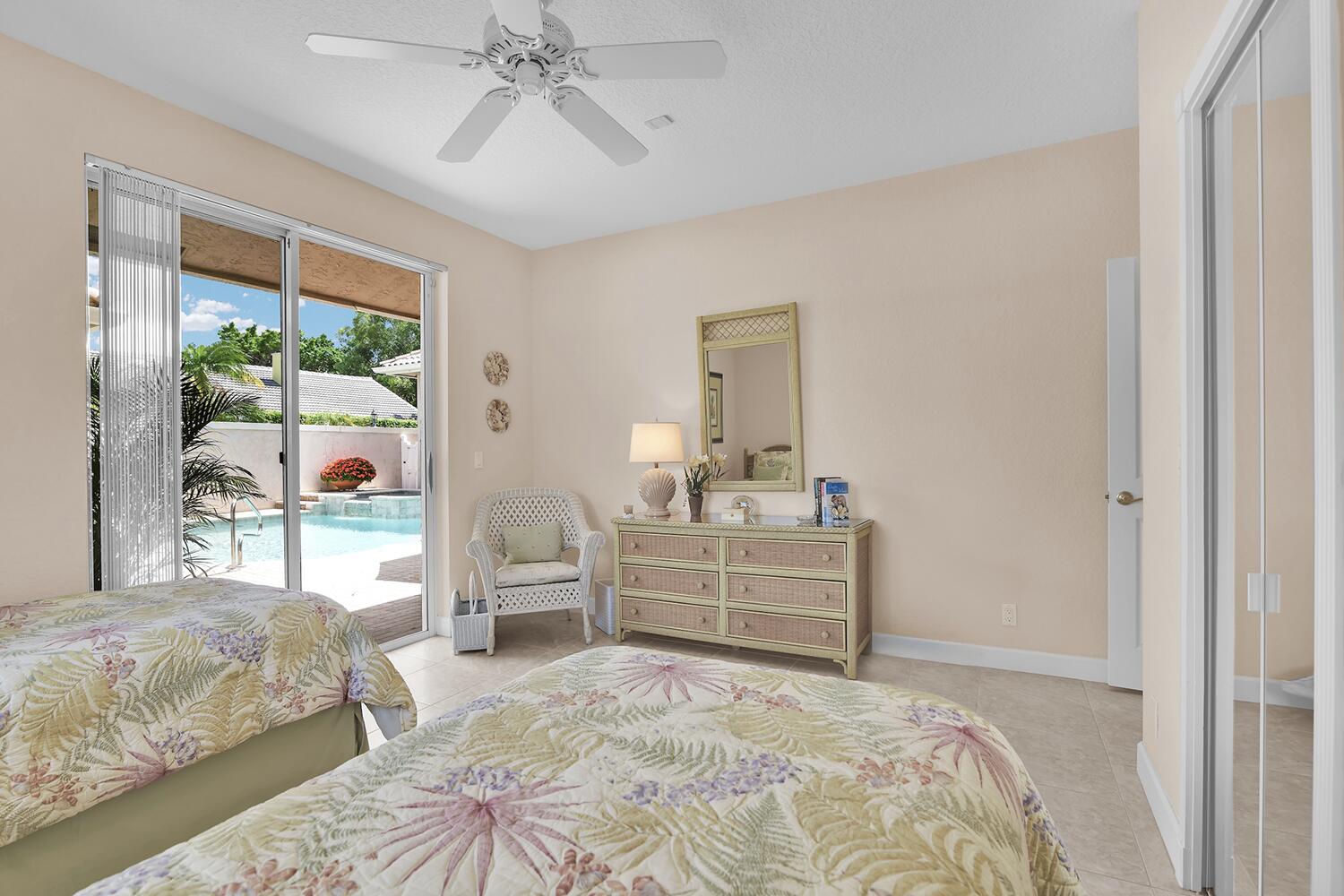 10721 St Andrews Road Boynton Beach, FL 33436 - Photo 18 of 27 a bedroom with a bed and a window