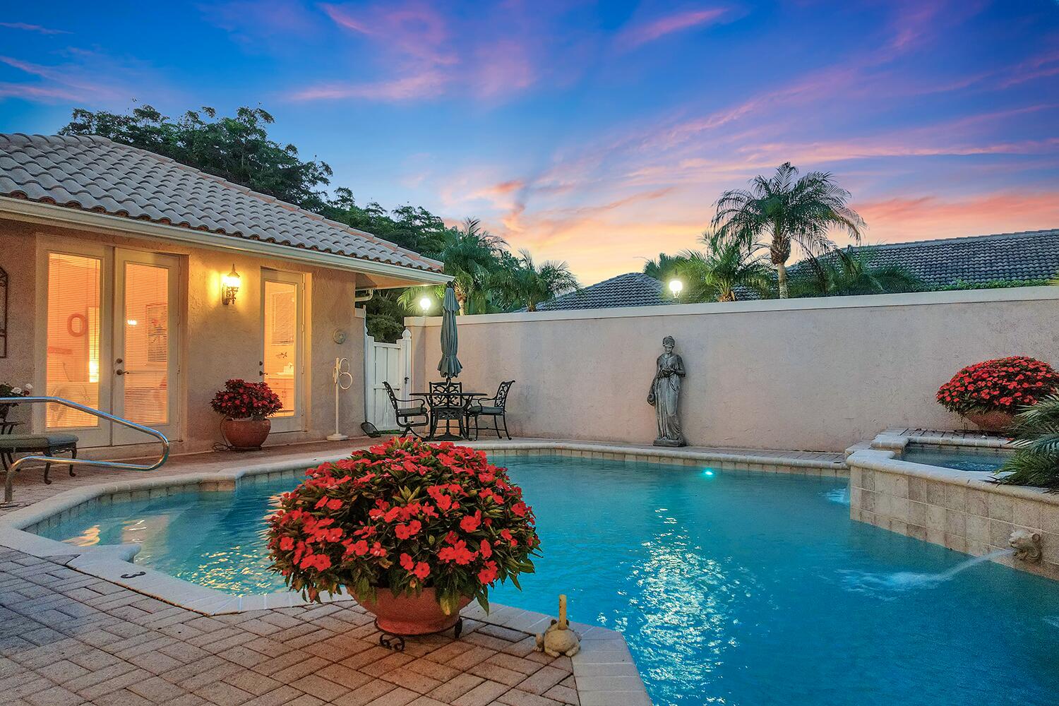 10721 St Andrews Road Boynton Beach, FL 33436 - Photo 25 of 27 a front view of a house with a yard