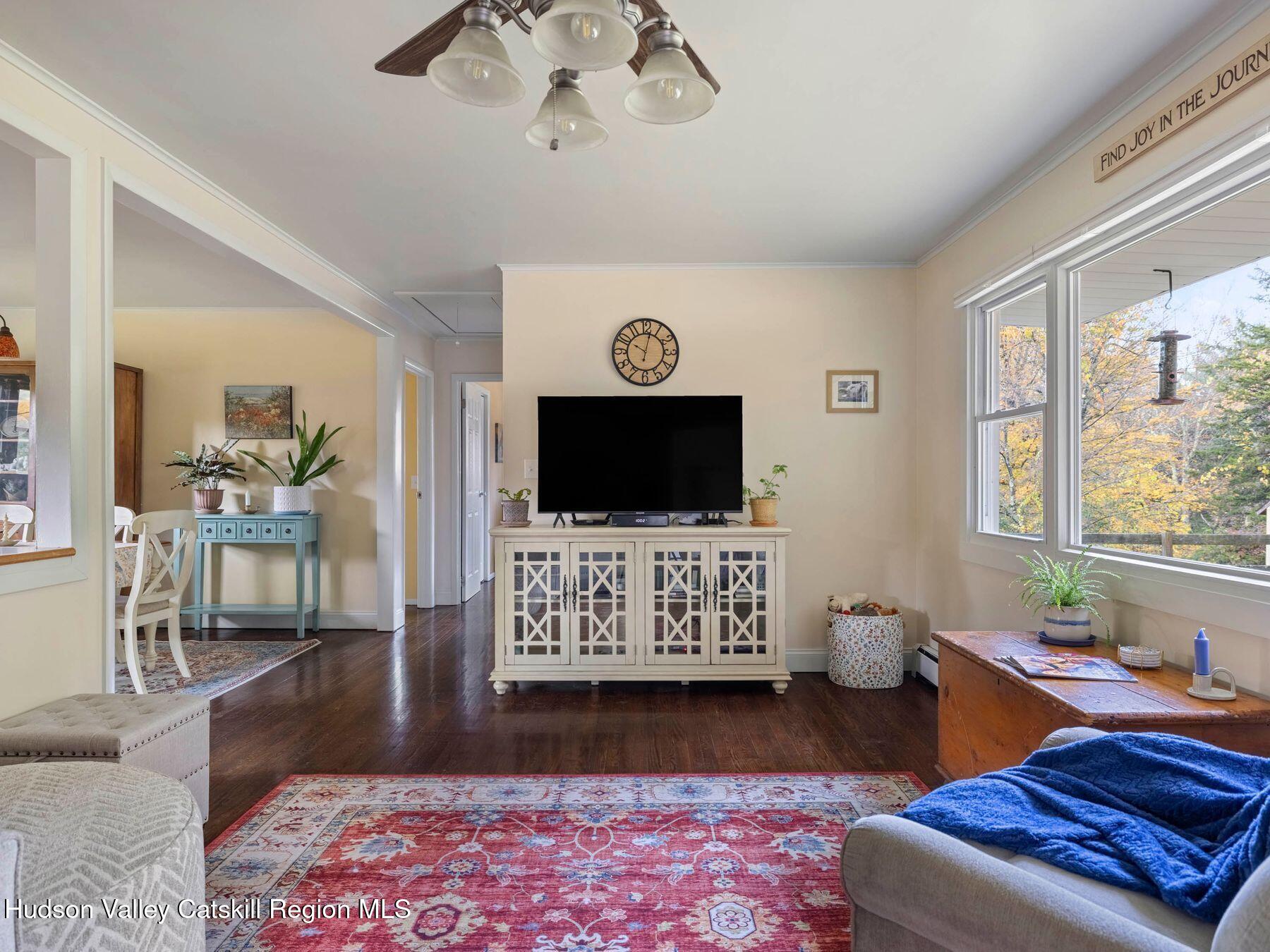 29 Hapeman Hill Road Red Hook, NY 12571 - Photo 13 of 63 a living room with furniture and a flat screen tv