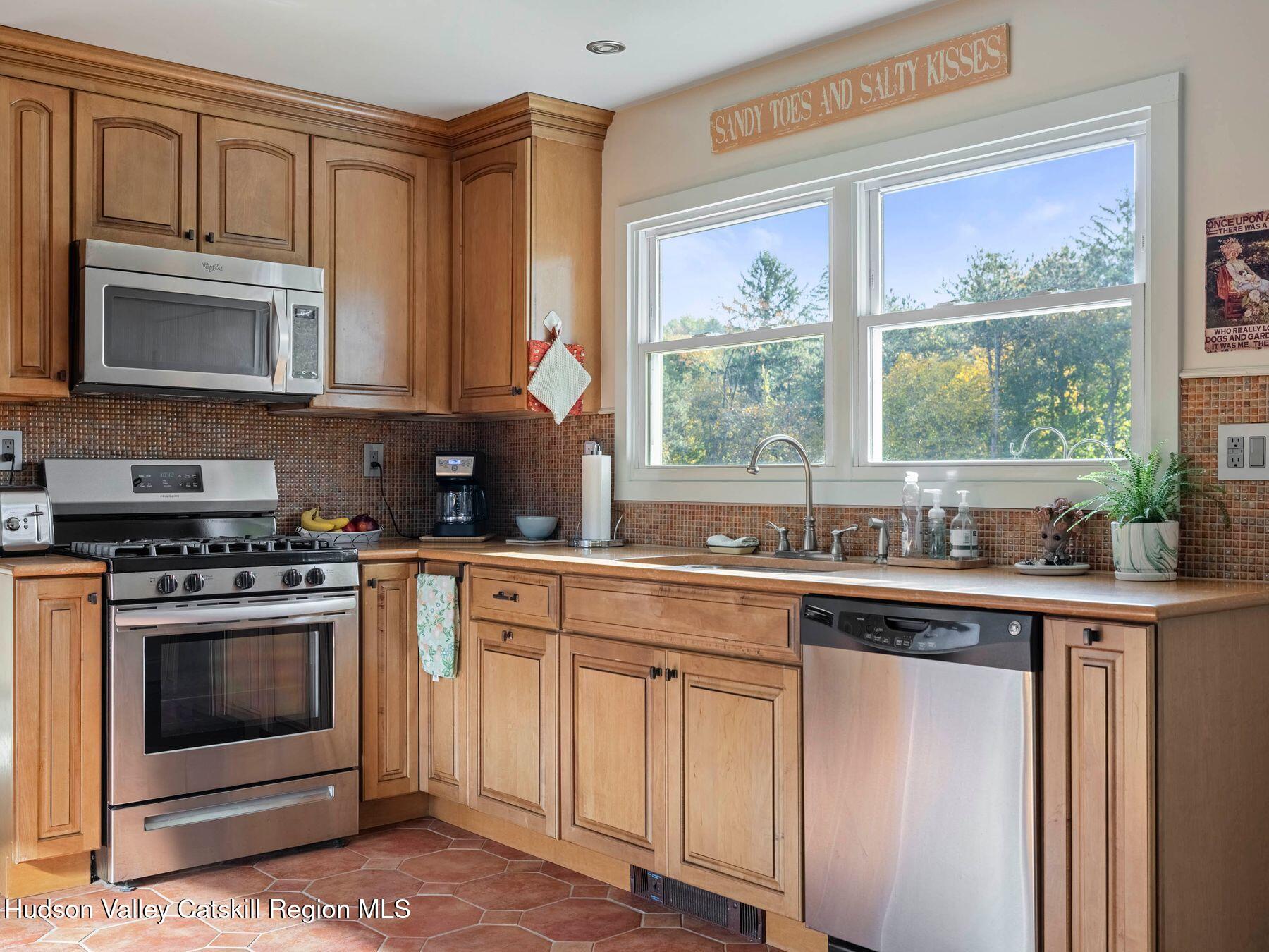 29 Hapeman Hill Road Red Hook, NY 12571 - Photo 20 of 63 a kitchen with cabinets appliances and a window