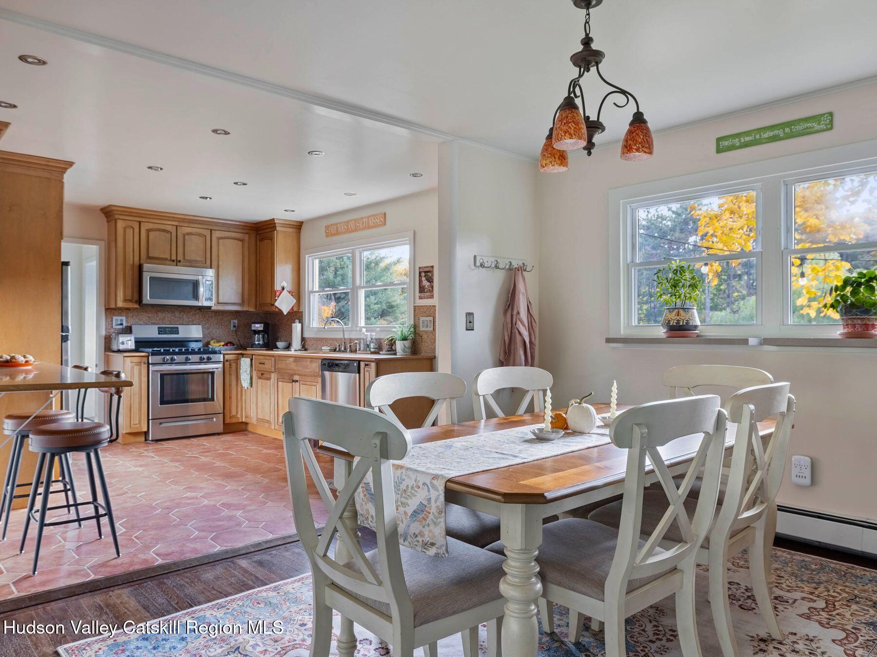 29 Hapeman Hill Road Red Hook, NY 12571 - Photo 22 of 63 a dining room with furniture a chandelier and wooden floor