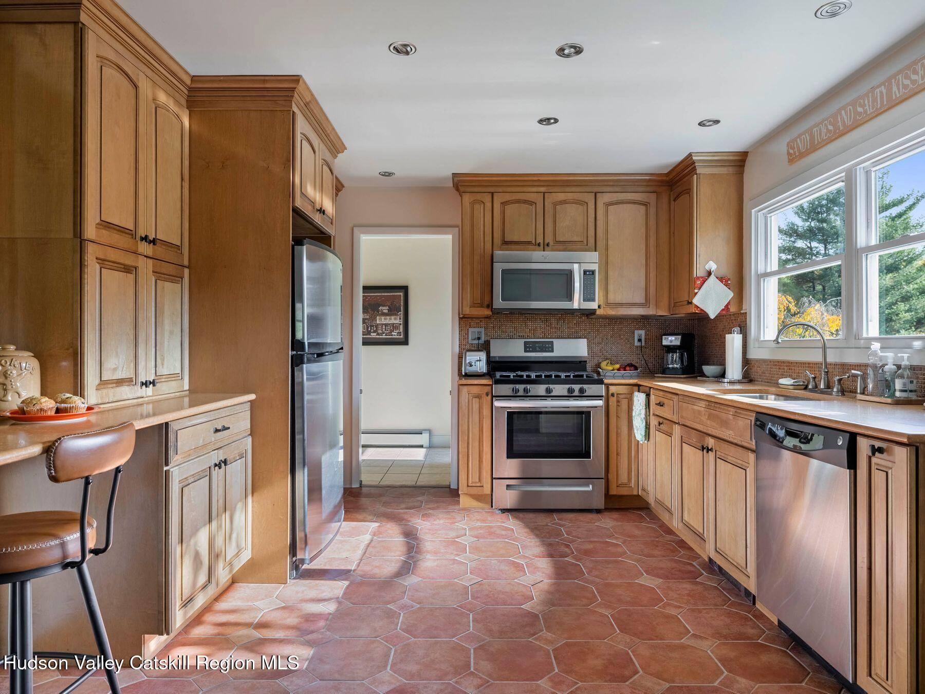 29 Hapeman Hill Road Red Hook, NY 12571 - Photo 26 of 63 a kitchen with stainless steel appliances granite countertop a refrigerator and a stove top oven