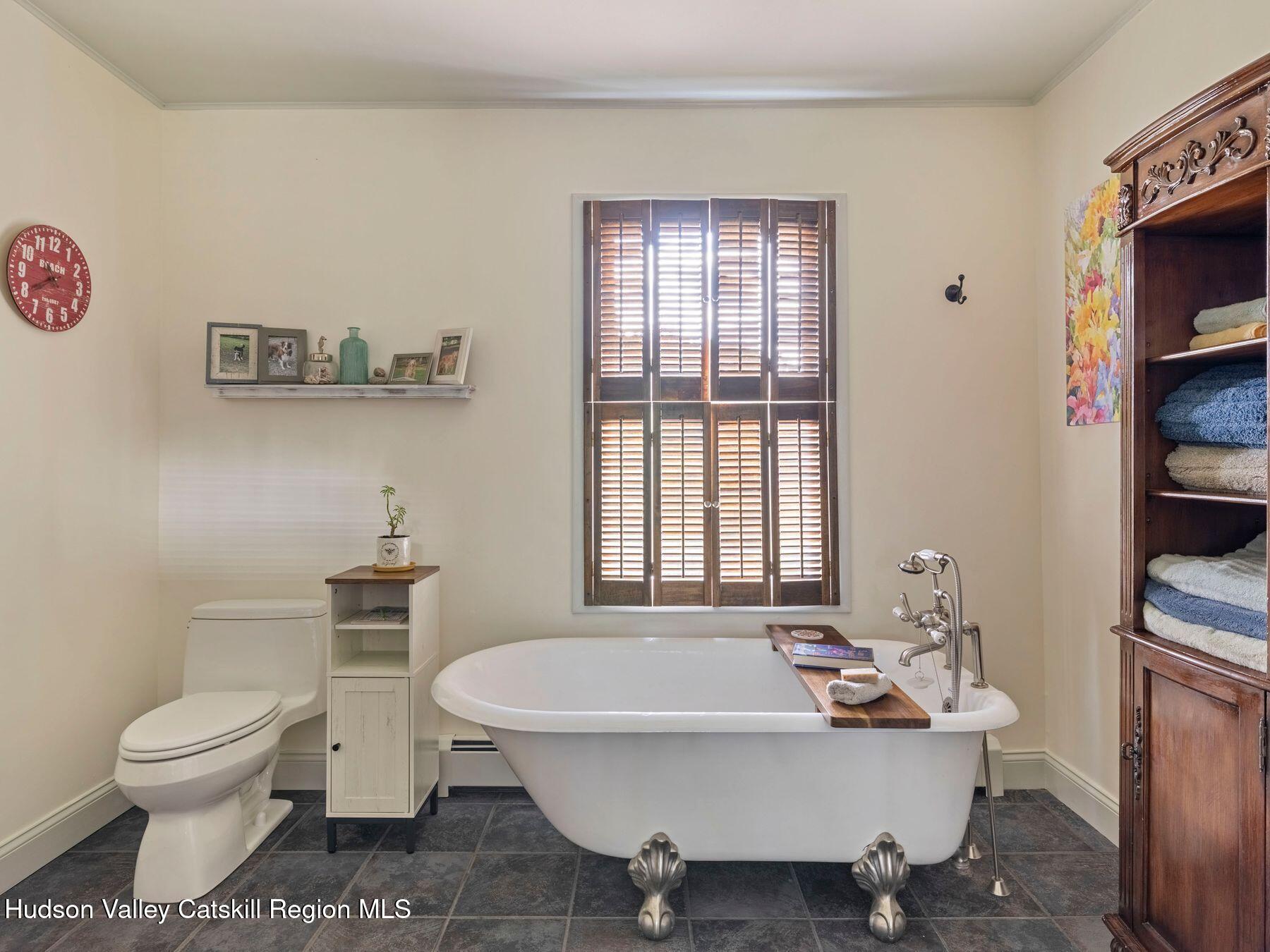 29 Hapeman Hill Road Red Hook, NY 12571 - Photo 37 of 63 a spacious bathroom with a toilet a sink and a bathtub