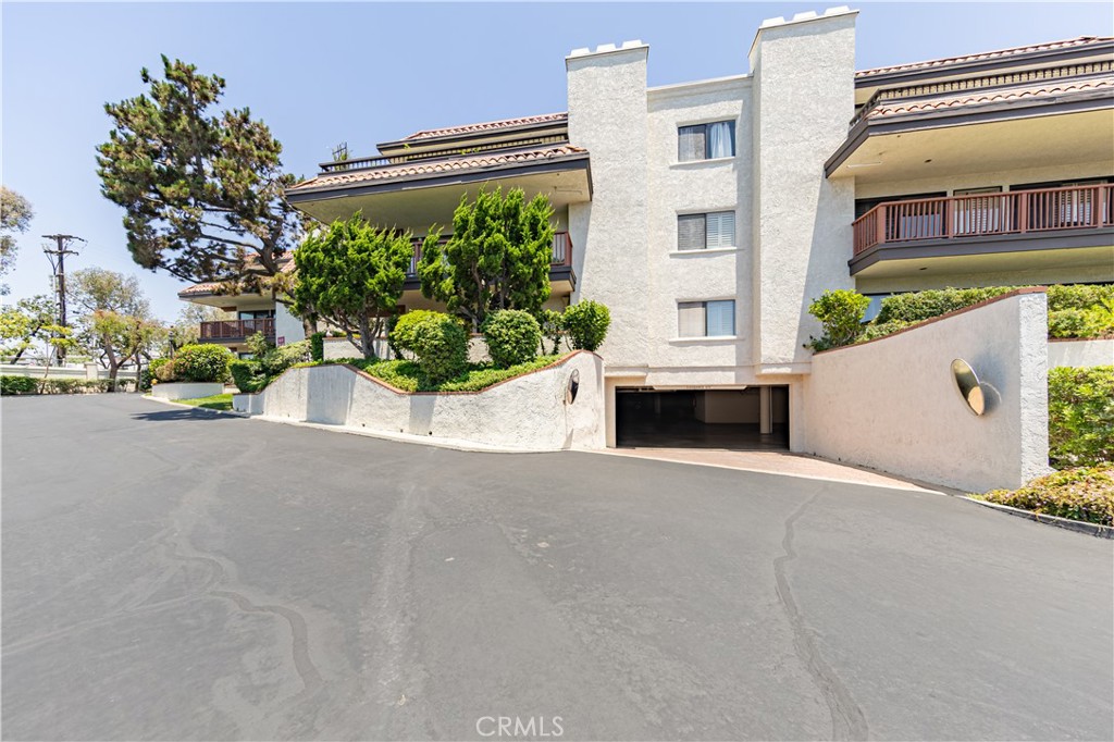 6242 Riviera Circle Long Beach, CA 90815 - Photo 24 of 29 front view of a house with a street