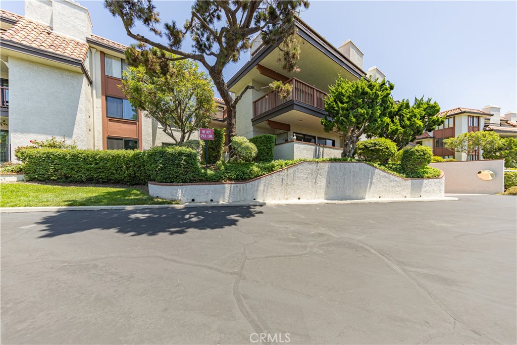 6242 Riviera Circle Long Beach, CA 90815 - Photo 25 of 29 front view of house with a yard