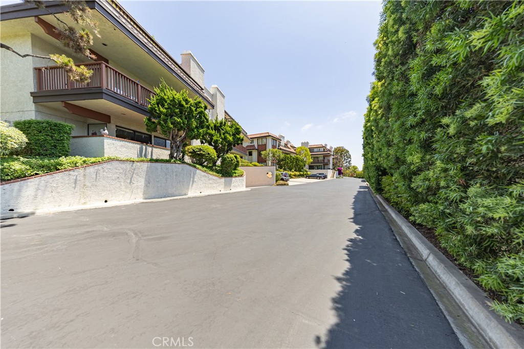 6242 Riviera Circle Long Beach, CA 90815 - Photo 26 of 29 a view of a street with a building