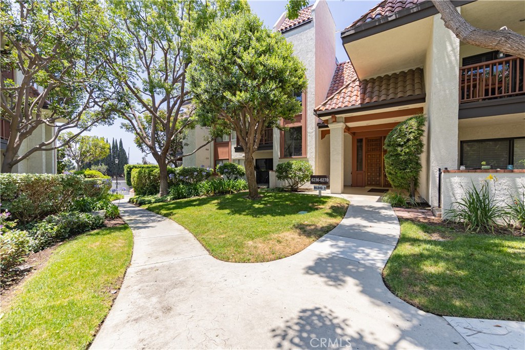 6242 Riviera Circle Long Beach, CA 90815 - Photo 29 of 29 front view of a house with a yard