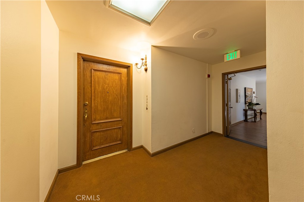 6242 Riviera Circle Long Beach, CA 90815 - Photo 3 of 29 a view of a hallway with a room