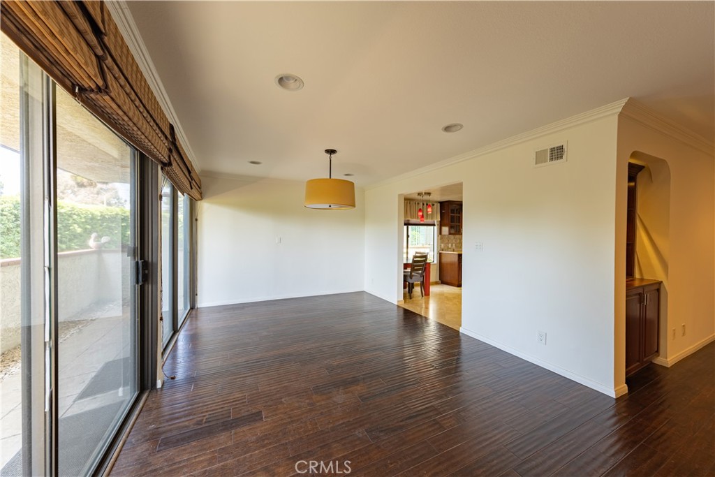 6242 Riviera Circle Long Beach, CA 90815 - Photo 6 of 29 a view of empty room with wooden floor and fan