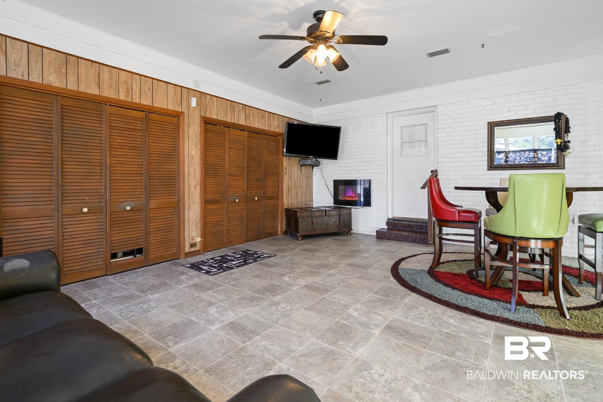 4105 Libby Drive Mobile, AL 36693 - Photo 20 of 26 Interior space with ceiling fan and brick wall