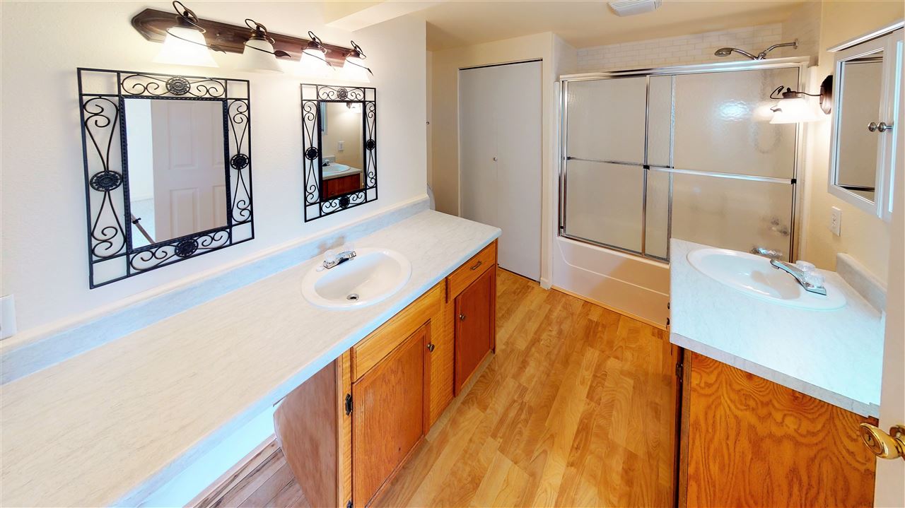 945 23 Road Grand Junction, CO 81505 - Photo 13 of 27 a bathroom with a tub sink and mirror