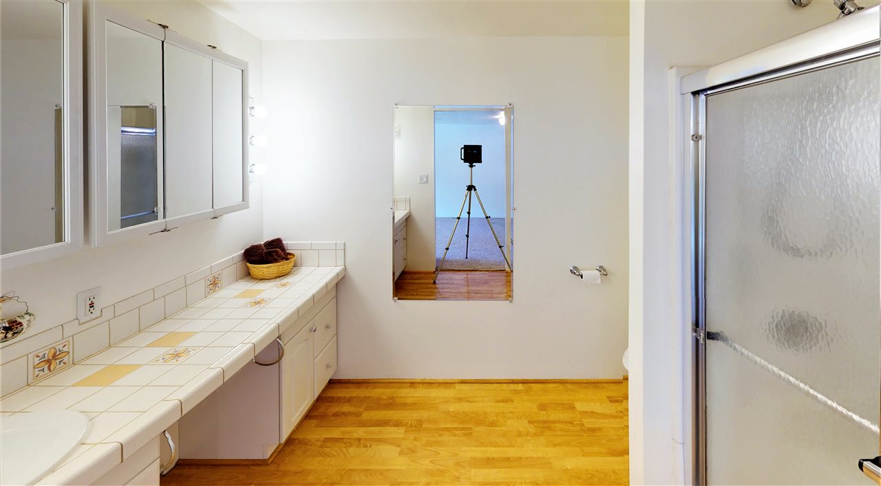 945 23 Road Grand Junction, CO 81505 - Photo 18 of 27 a bathroom with a tub sink and mirror
