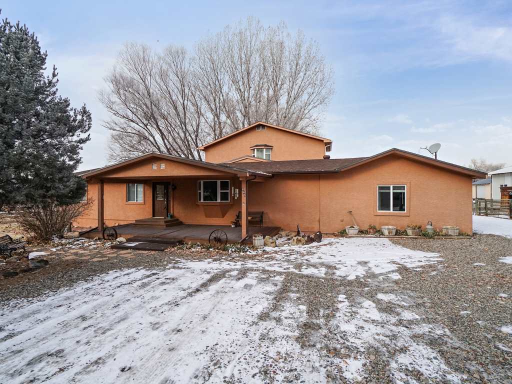 945 23 Road Grand Junction, CO 81505 - Photo 2 of 27 a front view of a house with a yard