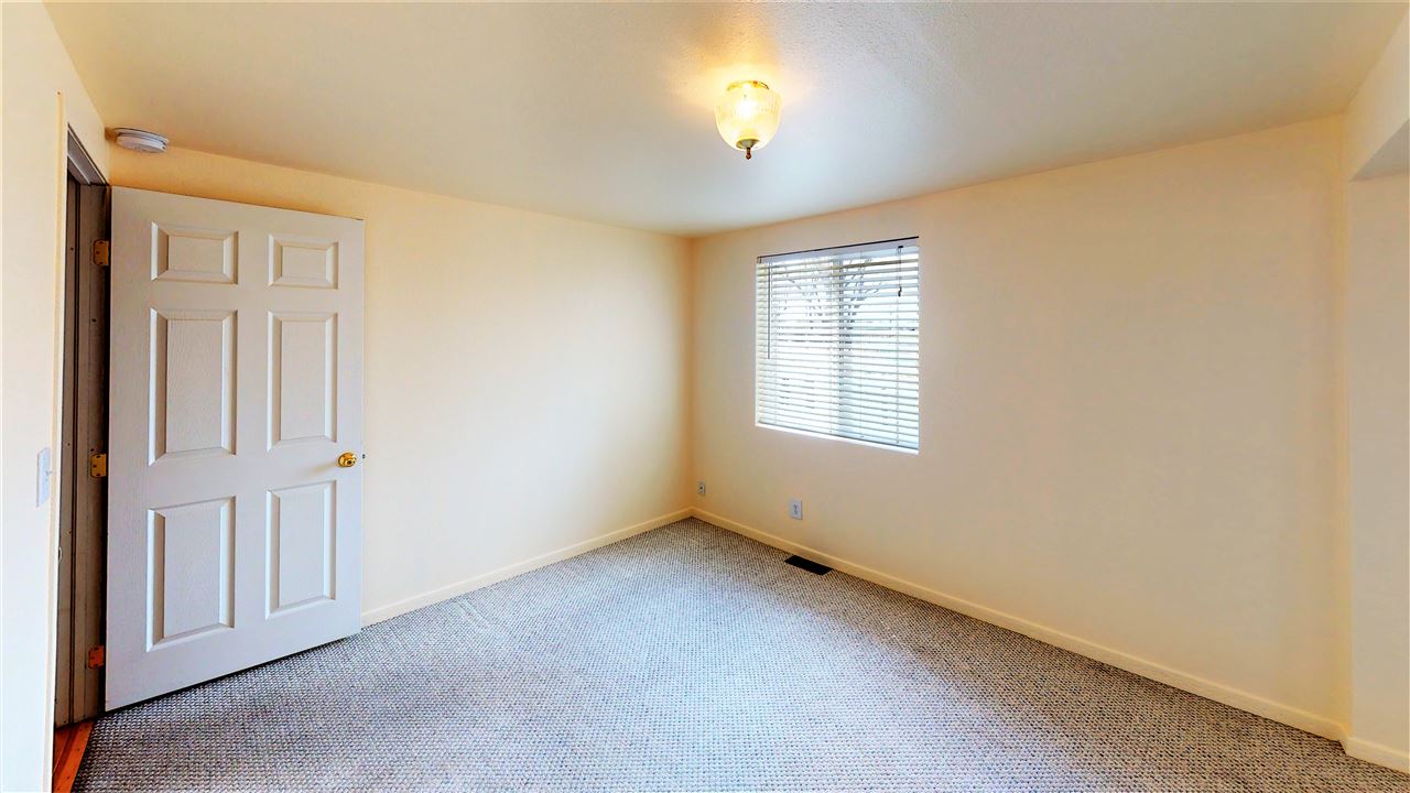 945 23 Road Grand Junction, CO 81505 - Photo 25 of 27 an empty room with windows