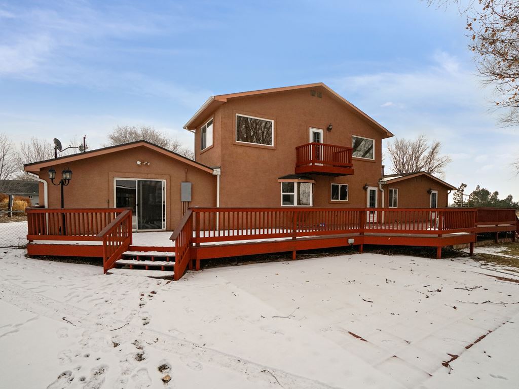 945 23 Road Grand Junction, CO 81505 - Photo 3 of 27 a front view of a house with a yard