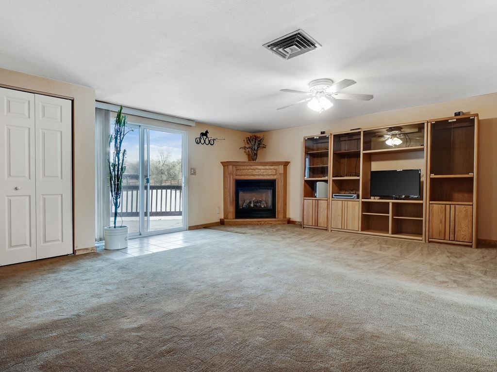 945 23 Road Grand Junction, CO 81505 - Photo 9 of 27 a view of an empty room with a fireplace and closet
