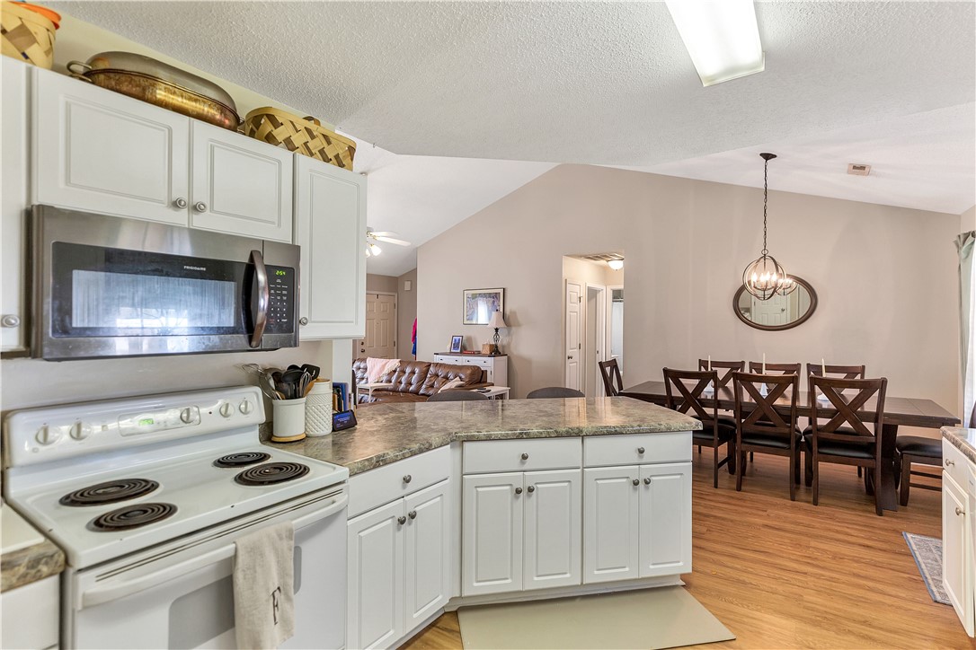 3338 Centerville Road Anderson, SC 29625 - Photo 11 of 28 This open concept kitchen and dining area features vaulted ceilings and ample counter space.