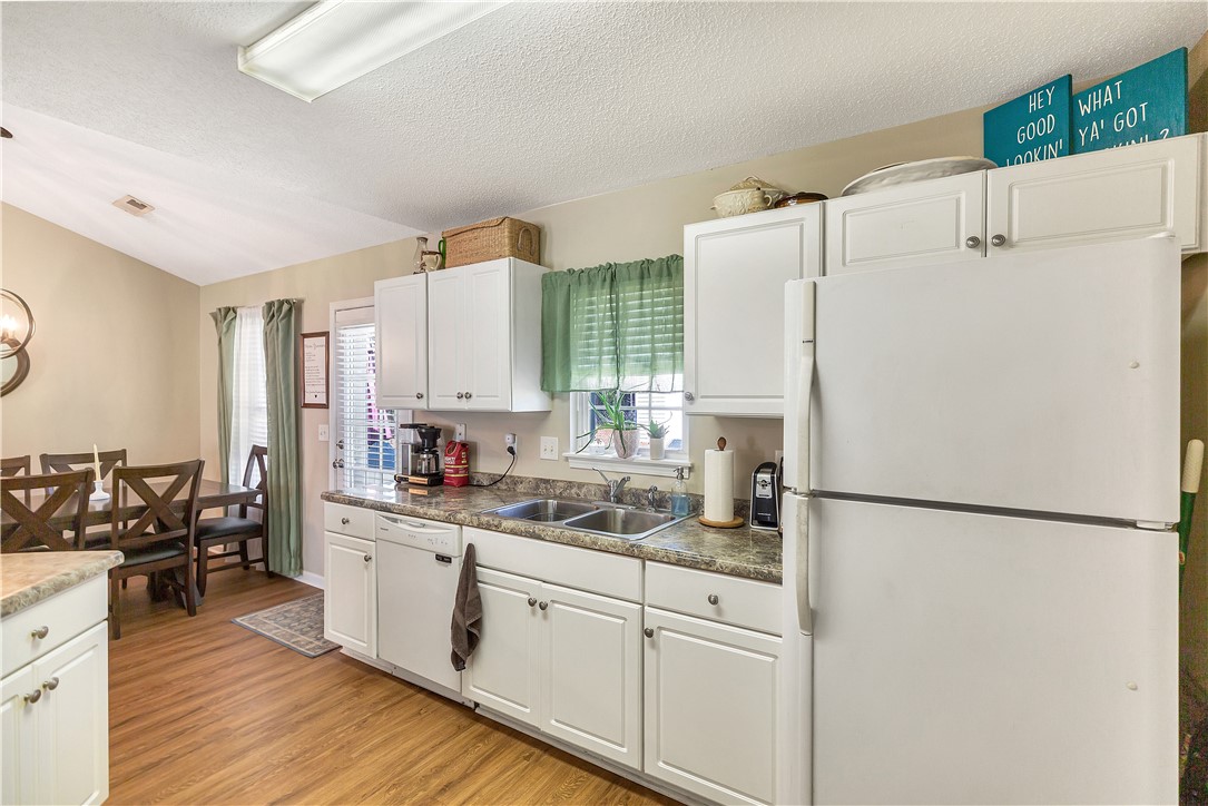 3338 Centerville Road Anderson, SC 29625 - Photo 12 of 28 This bright kitchen and dining area features sleek appliances and ample counter space, perfect for entertaining.