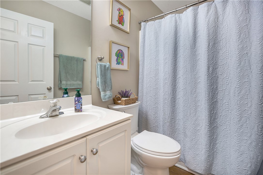 3338 Centerville Road Anderson, SC 29625 - Photo 20 of 28 This bright bathroom features a spacious vanity and a well-maintained commode, offering comfort and convenience.