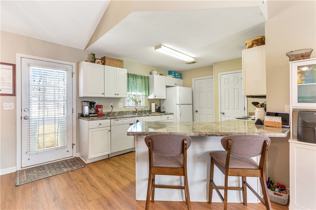 3338 Centerville Road Anderson, SC 29625 - Photo 9 of 28 This spacious kitchen offers a functional layout, abundant counter space, and a bright atmosphere.