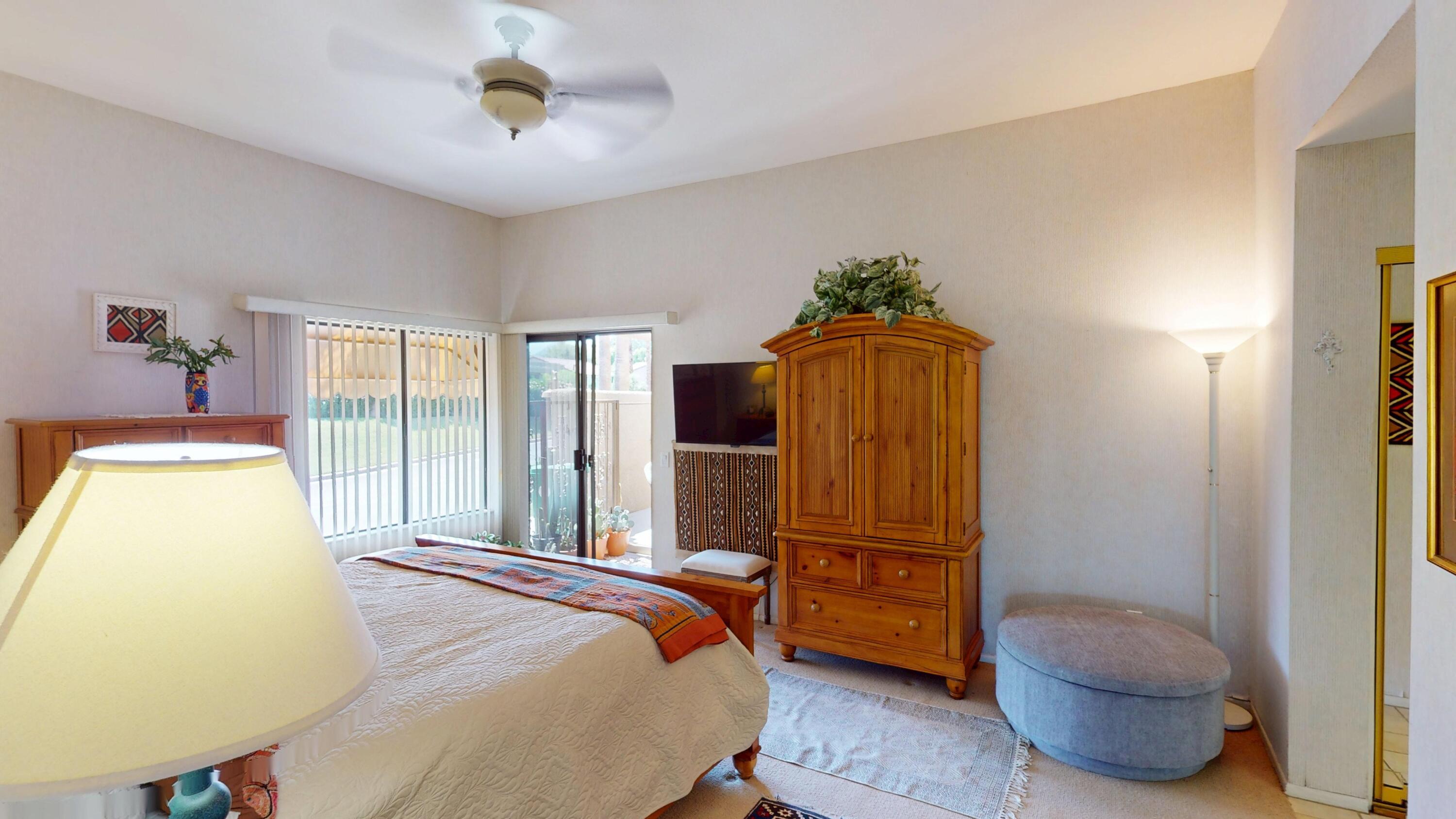 72350 Rim Drive Palm Desert, CA 92260 - Photo 11 of 30 a bedroom with a bed and dresser