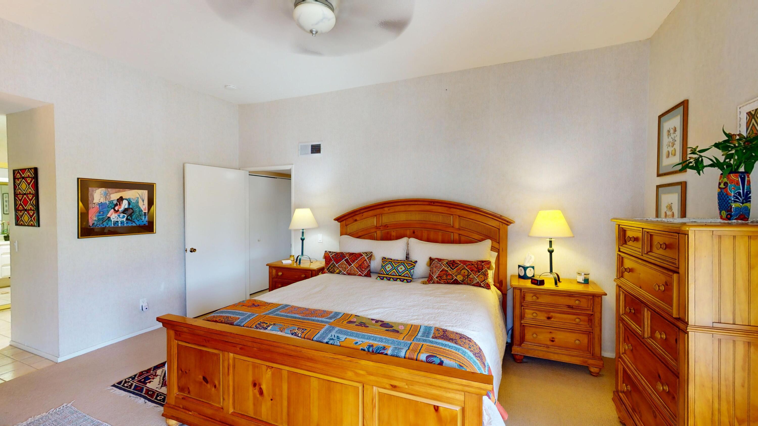 72350 Rim Drive Palm Desert, CA 92260 - Photo 13 of 30 a bedroom with a bed and a potted plant