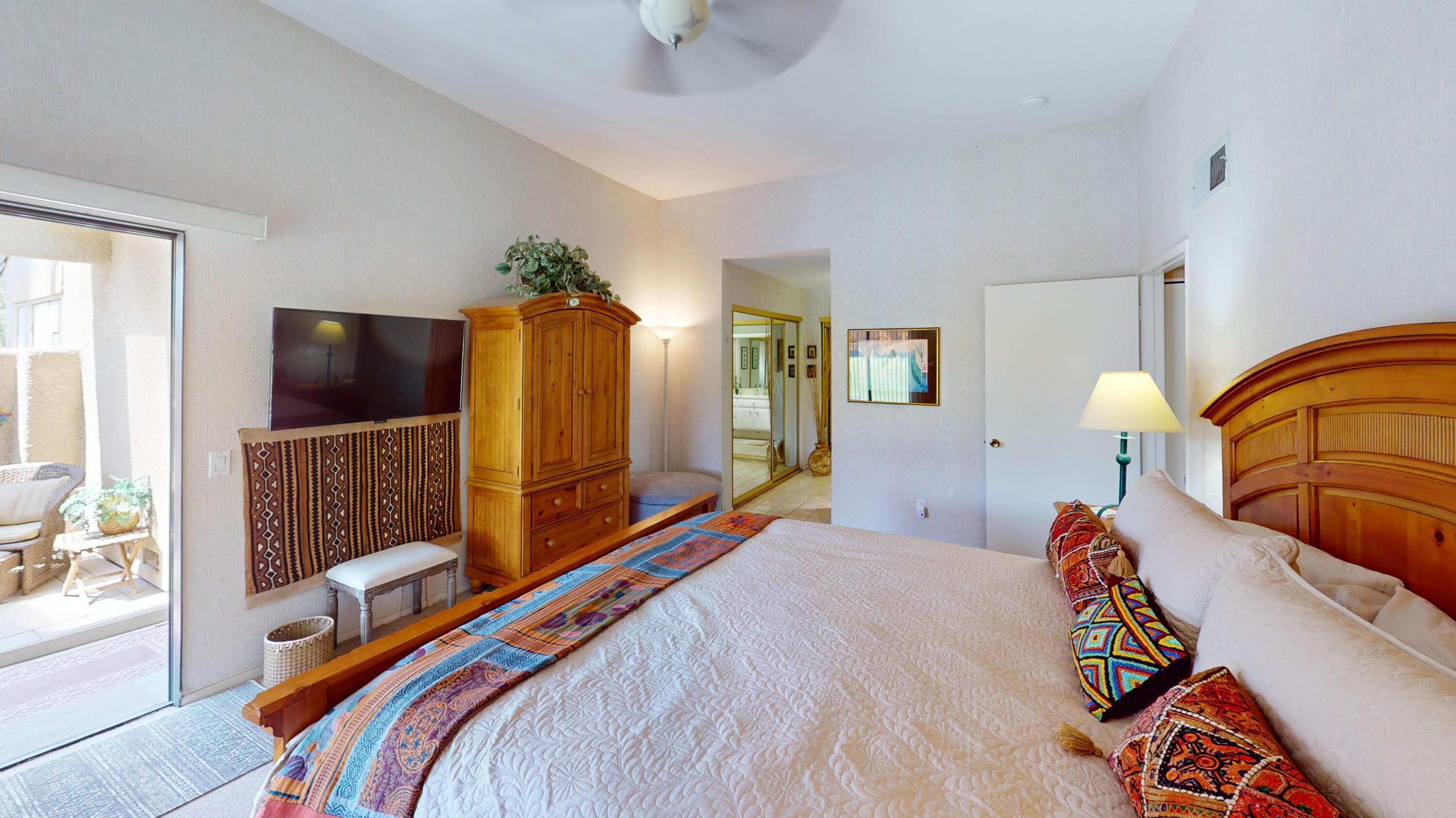 72350 Rim Drive Palm Desert, CA 92260 - Photo 14 of 30 a bedroom with a bed and dresser with mirror