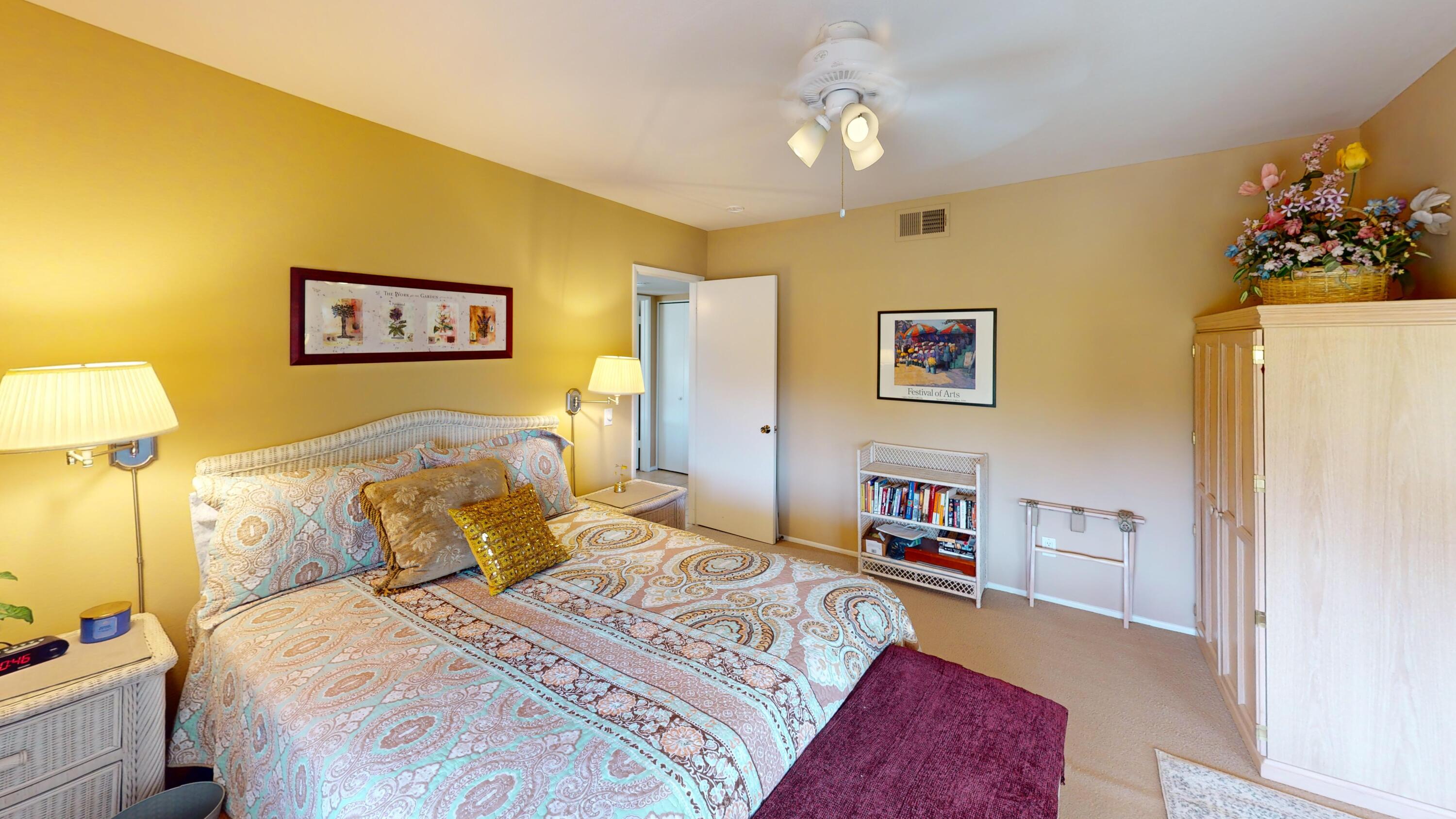 72350 Rim Drive Palm Desert, CA 92260 - Photo 18 of 30 a bedroom with a bed and a couch