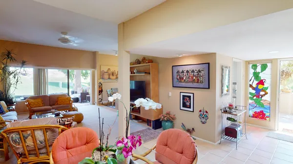 a living room with furniture toys and a large window