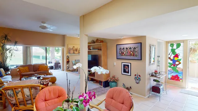 a living room with furniture toys and a large window