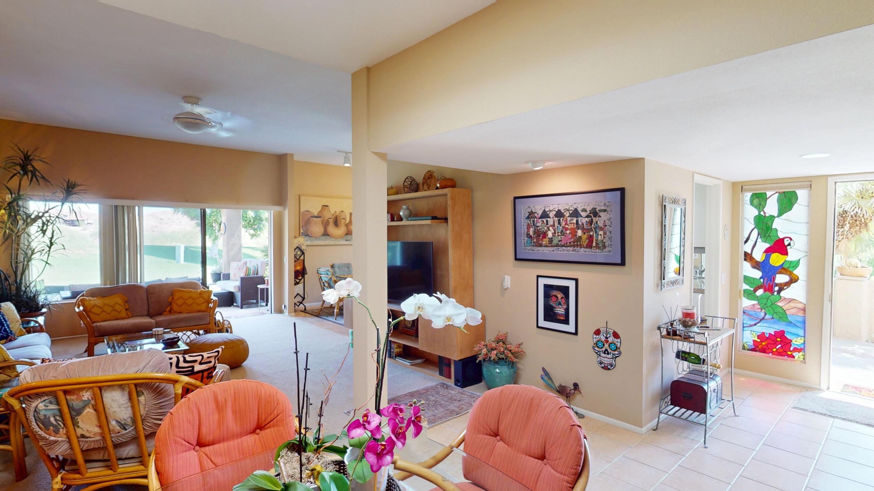 72350 Rim Drive Palm Desert, CA 92260 - Photo 5 of 30 a living room with furniture toys and a large window