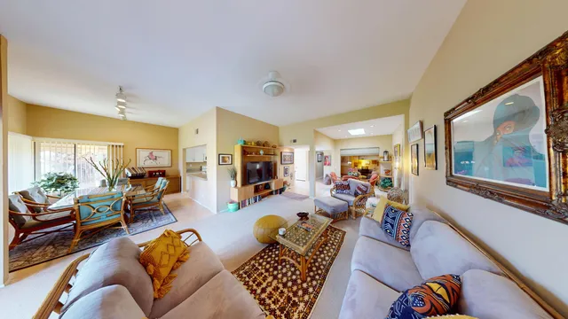 a living room with furniture or couch and a large window