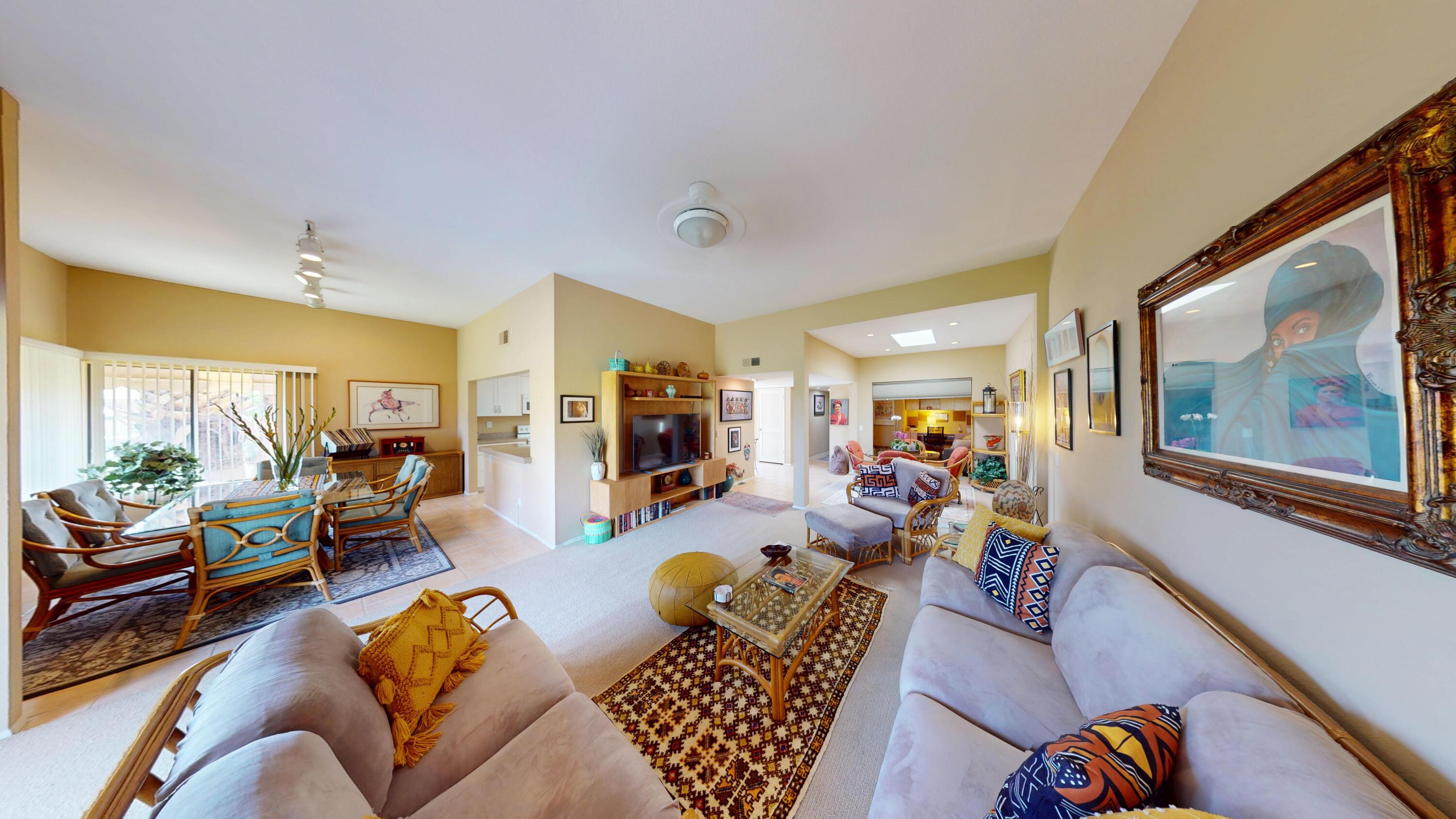 72350 Rim Drive Palm Desert, CA 92260 - Photo 7 of 30 a living room with furniture or couch and a large window