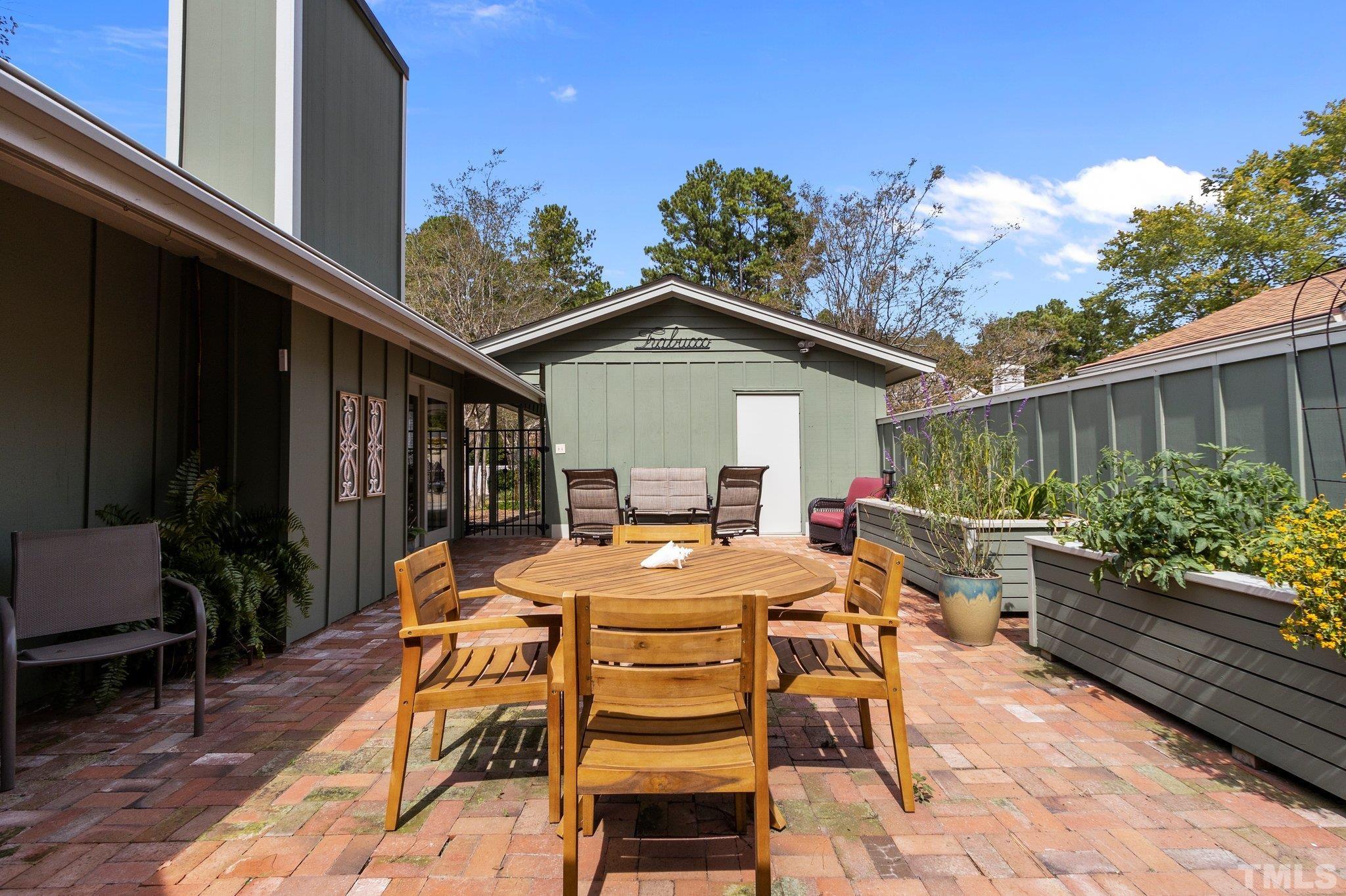 2704 Rue Sans Famille Raleigh, NC 27607 - Photo 5 of 43 a outdoor space with a table and chairs