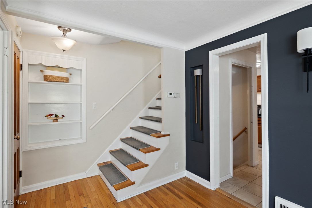 1444 Gordon Road Lyndhurst, OH 44124 - Photo 7 of 33 Staircase with wood-type flooring