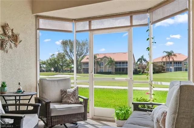 a view of a porch with furniture and garden
