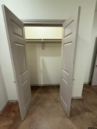 a view of an empty walk in closet