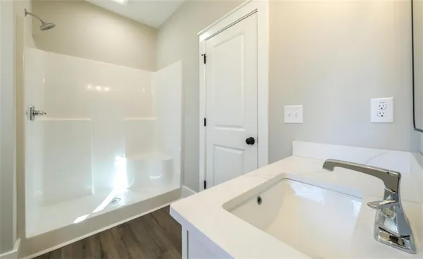 a bathroom with a tub and sink