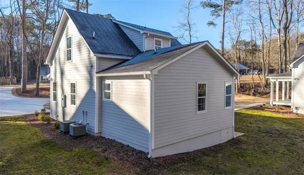 a view of house with backyard