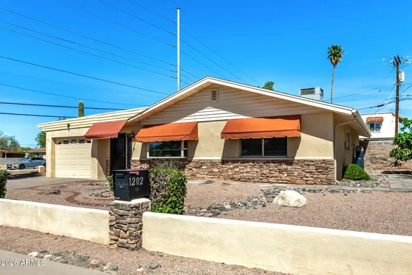 a front view of a house with parking