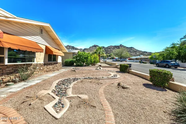 a view of a backyard with sitting area