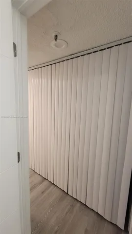 a view of room with furniture and wooden floor