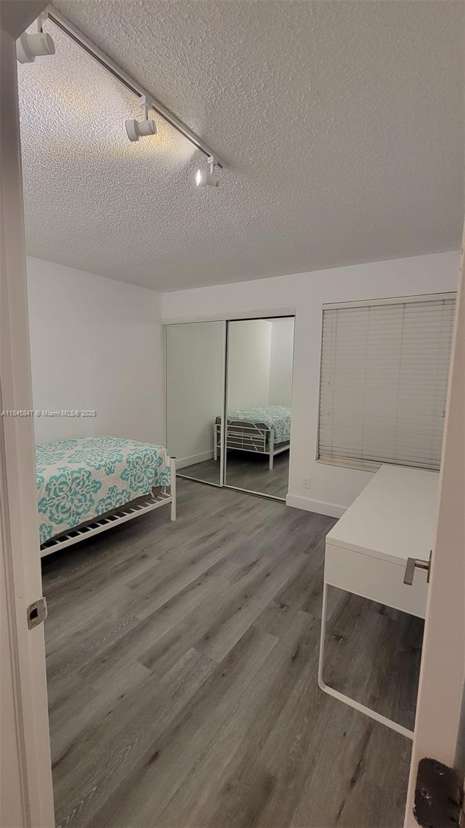 6562 Boca Del Mar Drive, Unit 225 Boca Raton, FL 33433 - Photo 20 of 24 a view of room with furniture and wooden floor